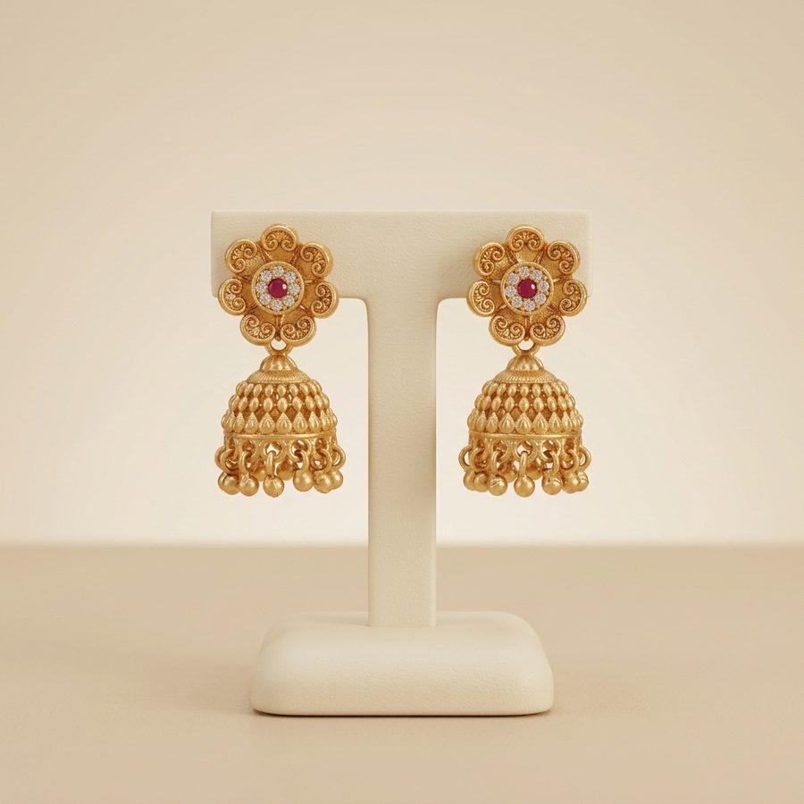 Gold floral jhumka earrings with crystal accents