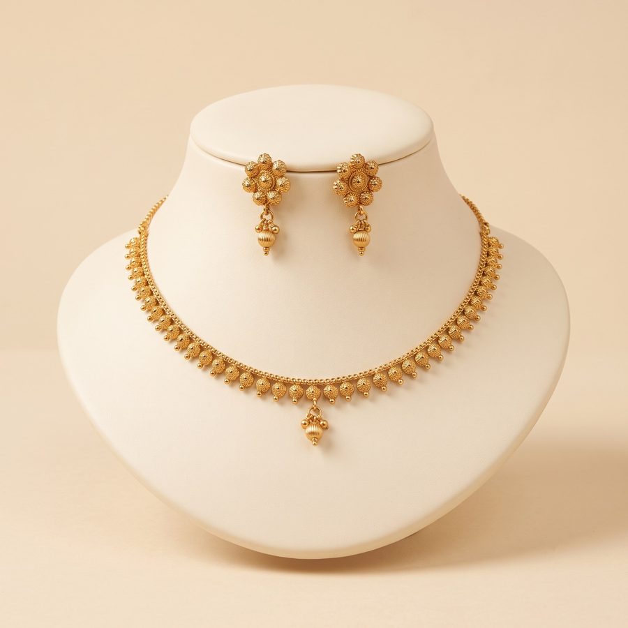Antique gold temple-style necklace with peacock motifs and coloured stone drops